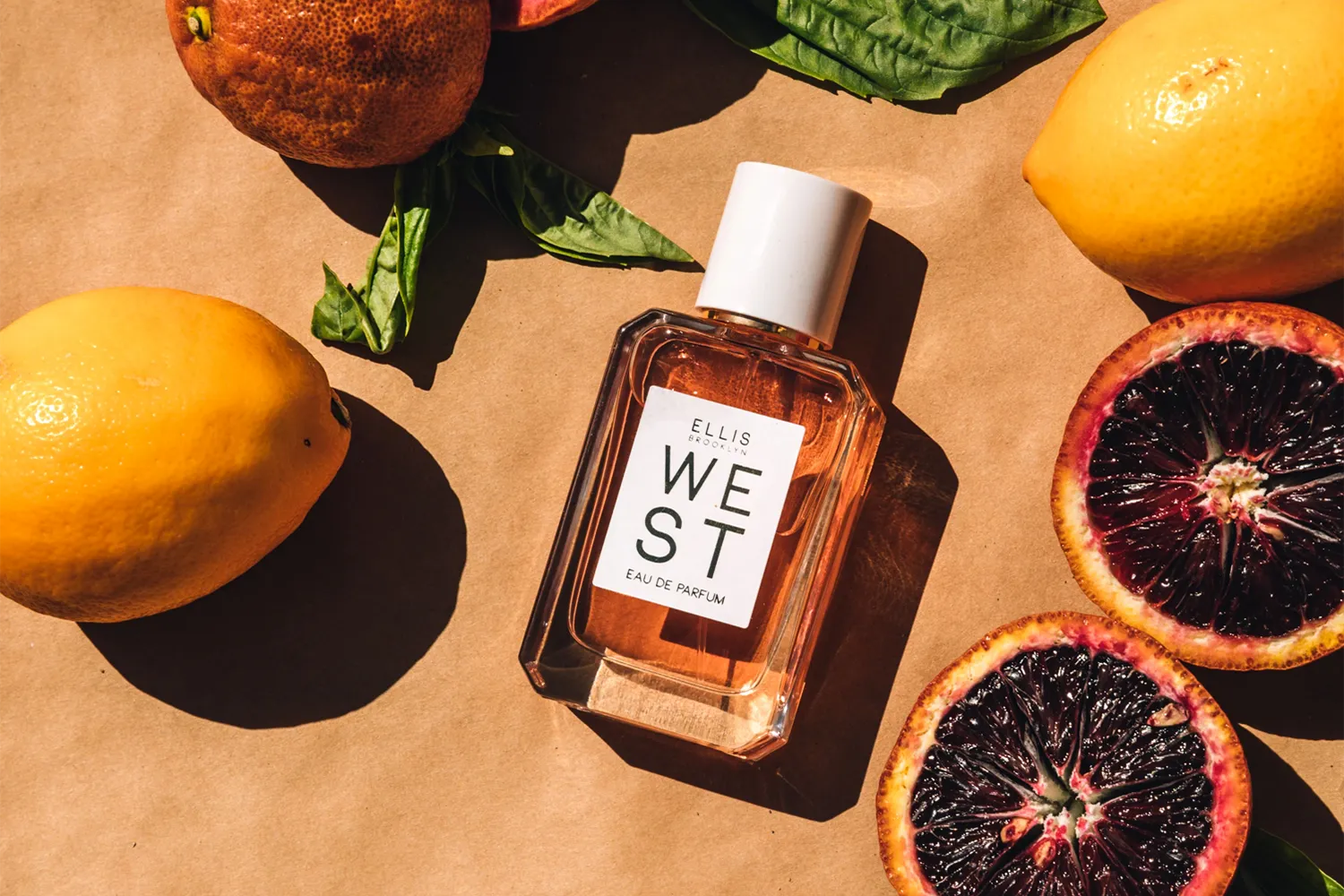Ellis Brooklyn West eau de parfum surrounded by citrus fruit
